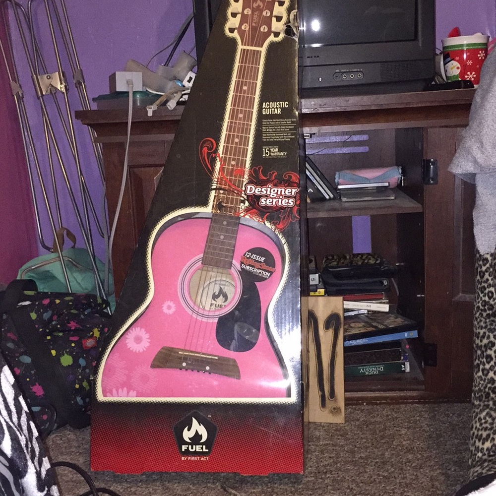 Designer series kids Pink guitar with flowers.
